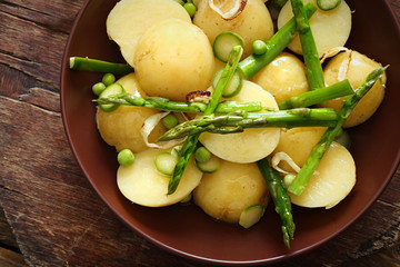 Fresh asparagus with potatoes on plate