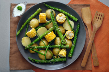 Grilled asparagus with vegetables on plate