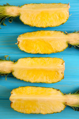 Pineapple slices on blue background