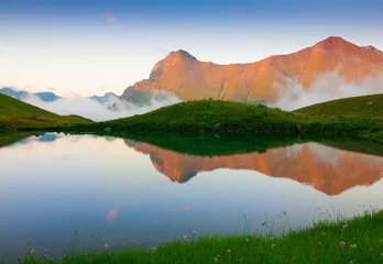 Tuinposter Lake. Mountain summer. Sunset. Green grass, fantastic, reflectio © erainbow