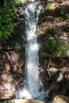 stron karst water spring with white water named Mlecny pramen in Kralicky Sneznik mountains in Czech republic near Dolni Morava