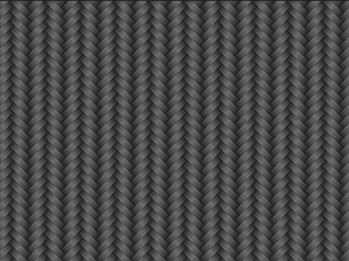 Texture of Carbon Kevlar Fiber material. Dark background.