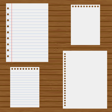 notebook paper on a wooden background