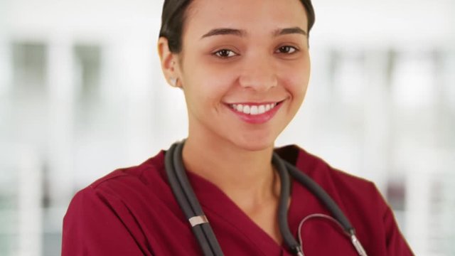 Latina nurse smiling at camera