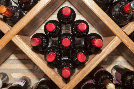 Rhomboid wine rack with multiple bottles of spanish red wine