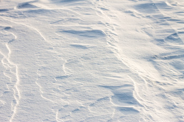 background snow waves at sunset by the wind