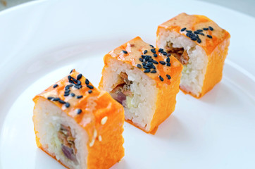 Close up of tasty fresh sushi rolls on plate