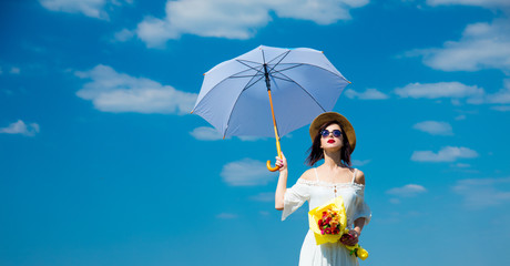 young woman with bouquet and umbrella
