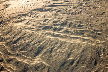 background snow waves at sunset by the wind