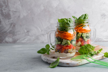 Healthy homemade mason jar salad with chicken and vegetables