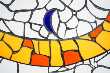 Mosaic wall painted in blue,white,yellow and orange colors