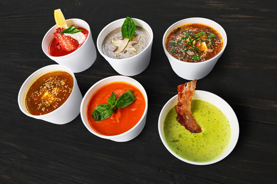 Variety of soups from different cuisines at black wood