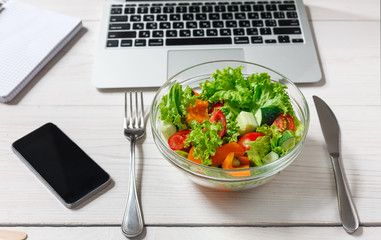 Healthy business lunch snack in office, vegetable salad bowl