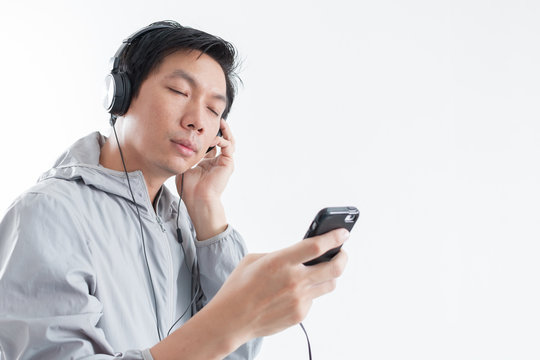 Young man listening to music with smartphone