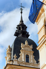 Fototapeta na wymiar The spire of the old house in Riga