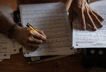 Man who is learning to read sheet music