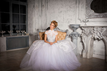 portrait of beautiful young bride woman sitting in chair