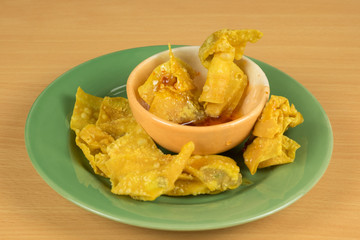 fried dumplings in green dish, Thai food style .(Selective focus)