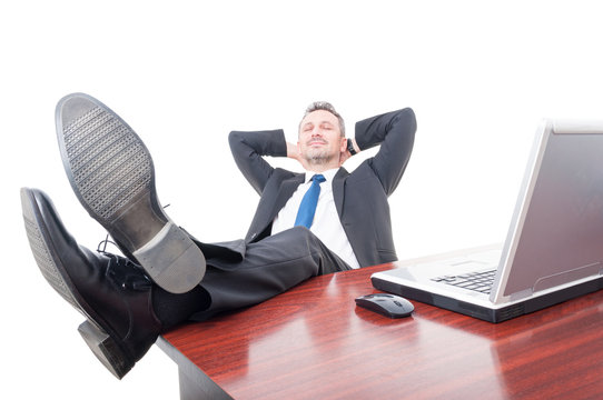 Young businessman relaxing in his office
