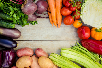 Fresh vegetables on wood background. Place for text.  