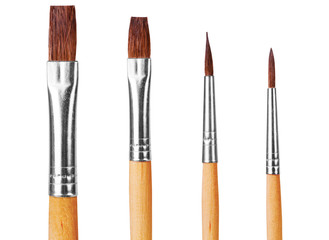 close up of paint brushes on white background
