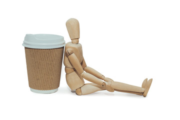 wooden mannequin  with cup of coffee isolated on white