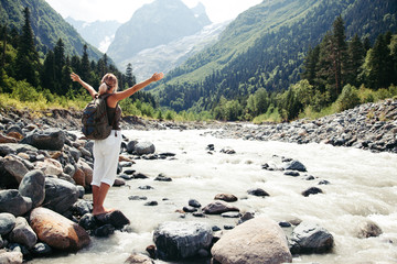 Traveler walking by the river