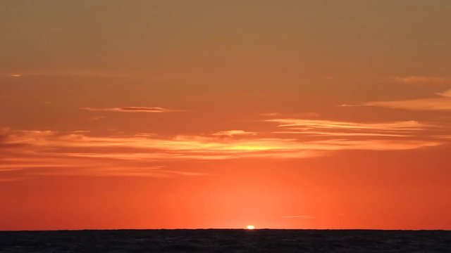 Time lapse sunset on Italian beach. Summer season. Adriatic sea.