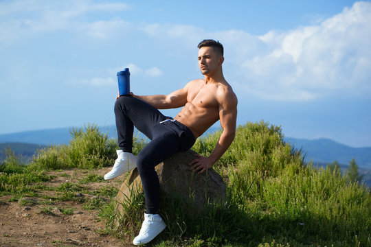 muscular man with water bottle