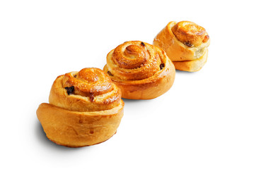 Three buns with raisin isolated on white.