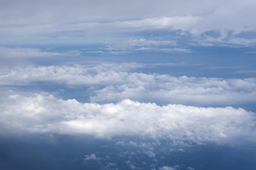 Naklejka na ściany i meble blue sky with clouds aerial view from airplane