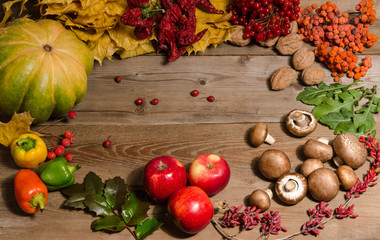 frame from vegetables, nuts, berries and  fruits over old wooden