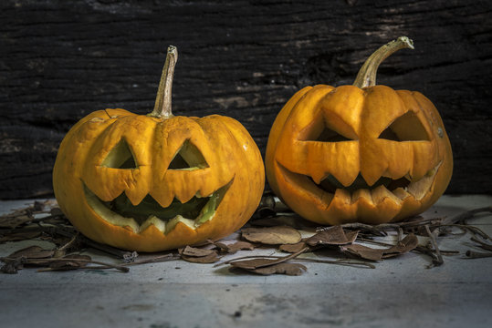 Halloween pumpkins on grungy wooden background