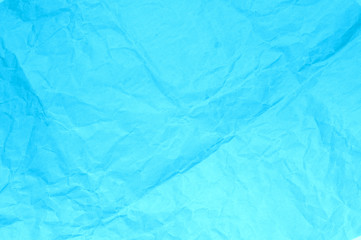 sfondo azzurro, carta sgualcita