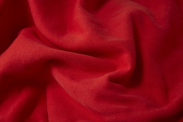 A full page close up of red sweats fabric texture