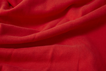 A full page close up of red sweats material texture © beckystarsmore