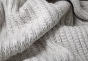 Crédence de cuisine en verre imprimé Poussière A full page close up of cream chunky knitted jumper fabric texture