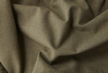 A full page close up of khaki green canvas fabric texture