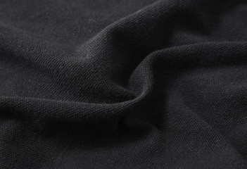 Une pleine page en gros plan de la texture du tissu noir