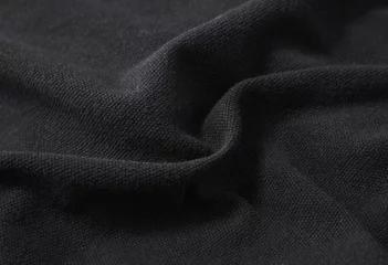 Photo sur Plexiglas Poussière Une pleine page en gros plan de la texture du tissu noir