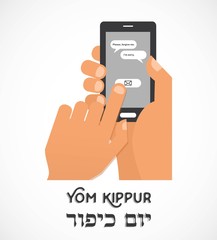 hand holding a smartphone and sending traditional message for Jewish holiday Yom Kippur