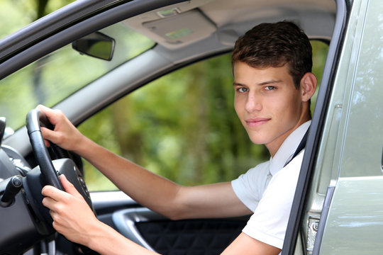 Young man driving a car