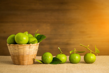 Green lemon in the basket