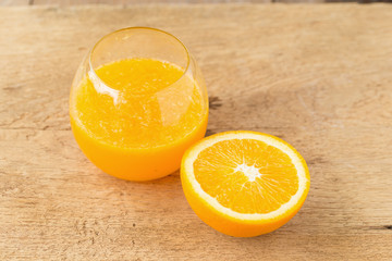 Glass of Orange Smoothie on wooden table