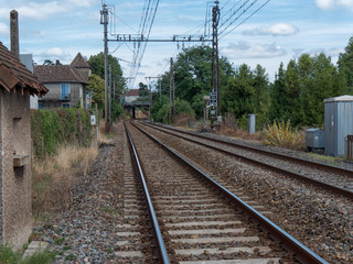 Fototapeta na wymiar Railway track with a village in France
