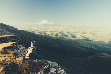 Traveler looking to Elbrus mountain