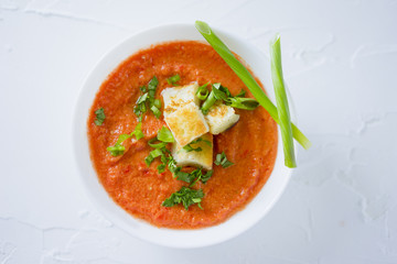 Tomato soup in white plate