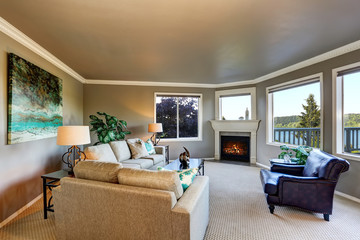 Cozy living room interior with fireplace and black coffee table.