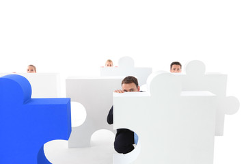 Business people and puzzle