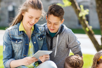 group of students with tablet pc at school yard